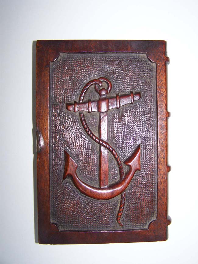 A Wooden 'Memorial' Book with carved Anchor on the front and a carving of the ship 'EURYDICE' on the back. The brass clasp is engraved 'Relic of the Eurydice, Lost March 24, 1878.'
